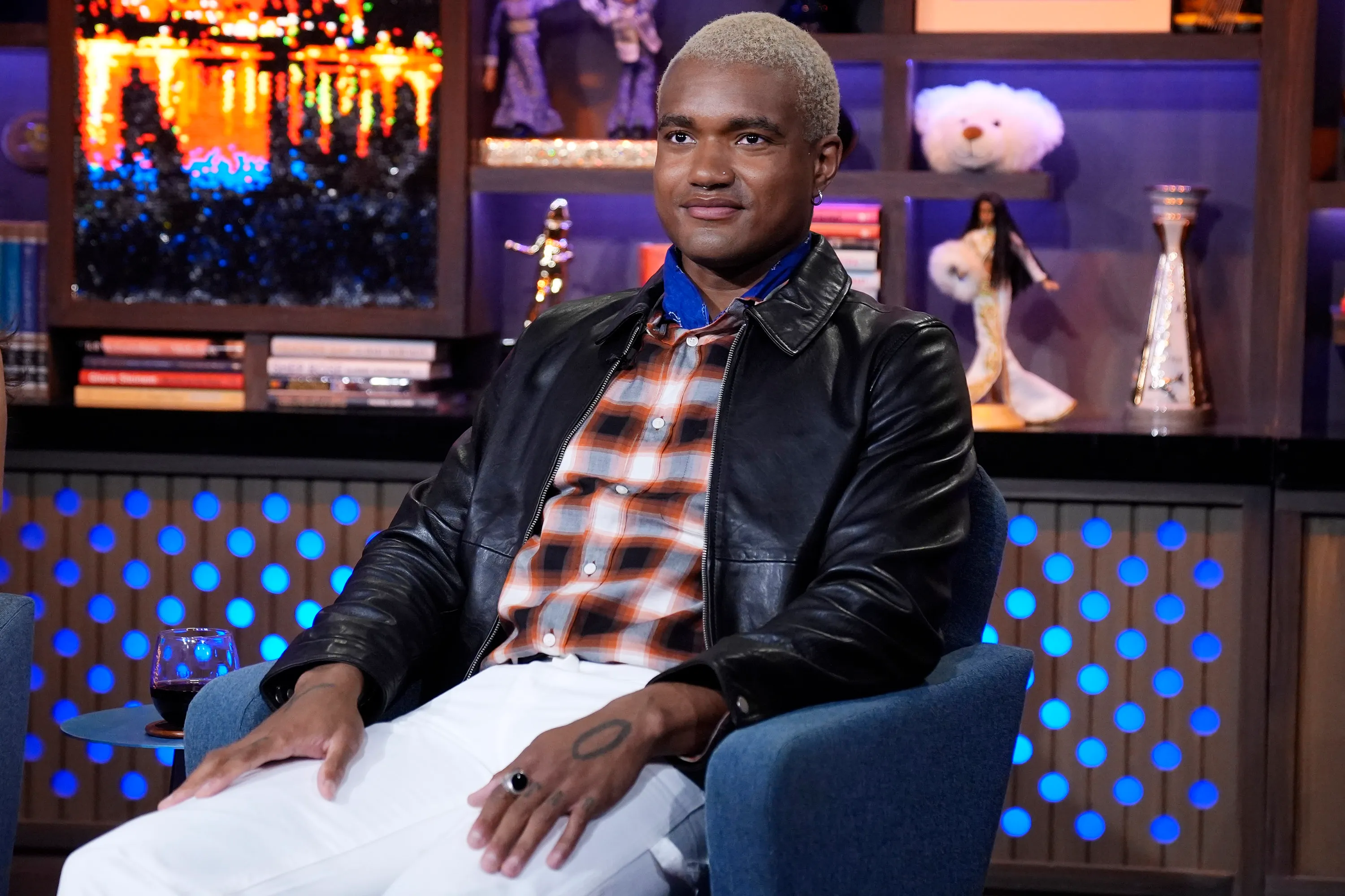KJ Dillard sitting in a blue armchair.