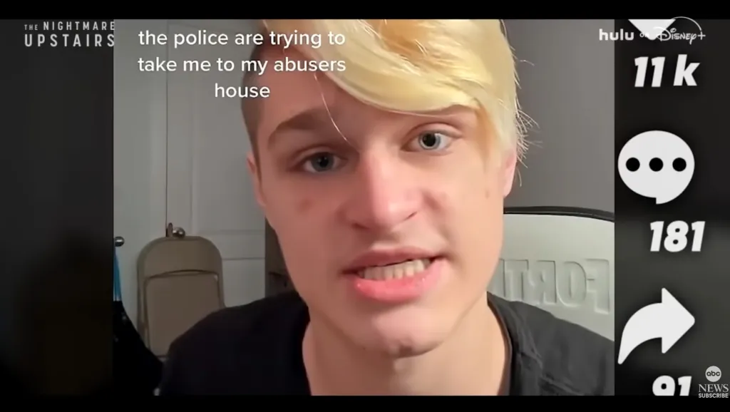 A person with blonde hair and blue eyes speaking into the camera with text overlay "the police are trying to take me to my abusers house".