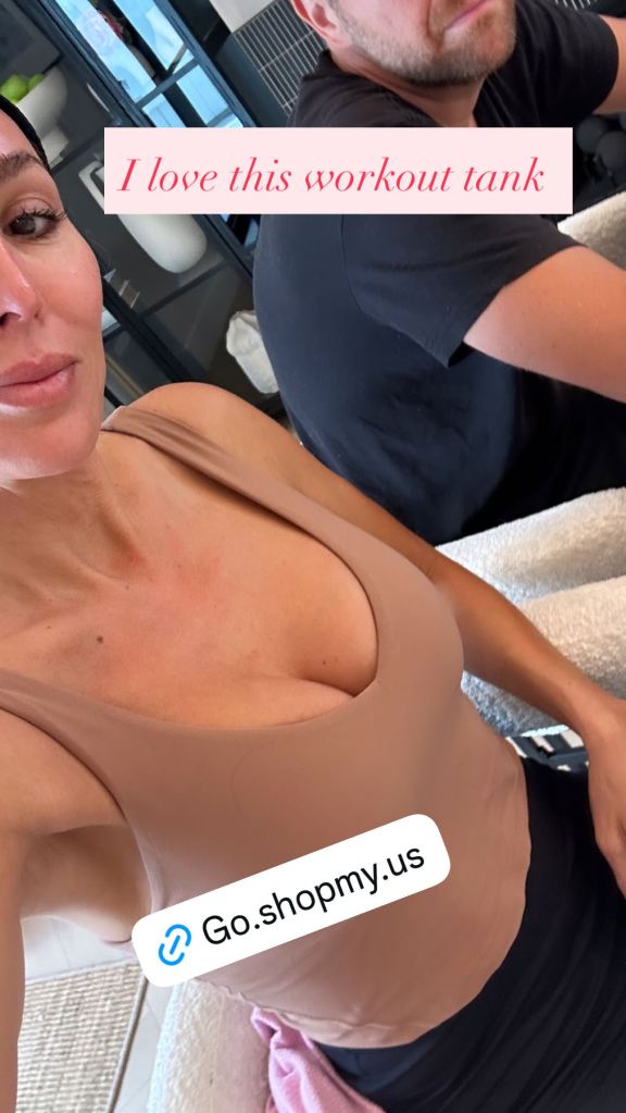 Woman in a nude-colored tank top with "I love this workout tank" and a link to Go.shopmy.us.