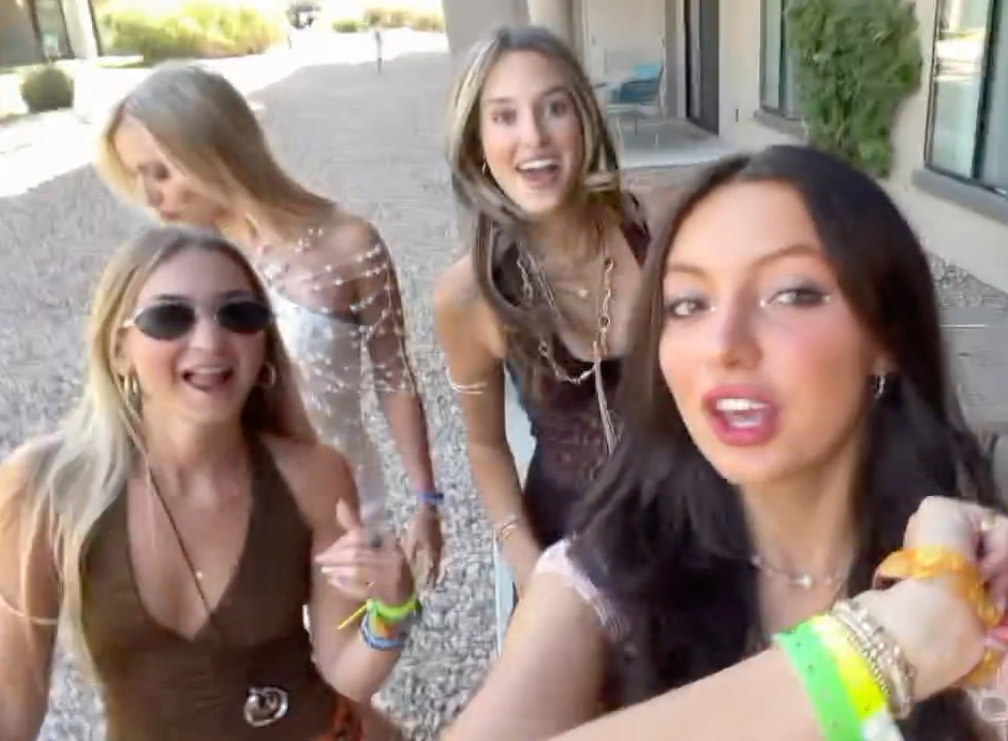 Skyler Moses and three friends posing outdoors.