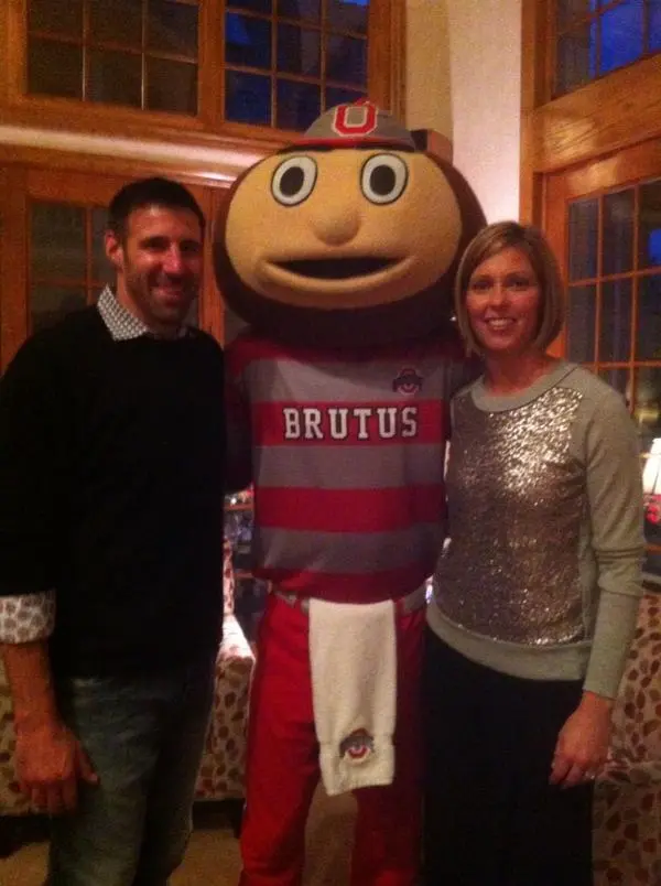 Mike Vrabel and wife Jen Vrabel pose with Brutus Buckeye.