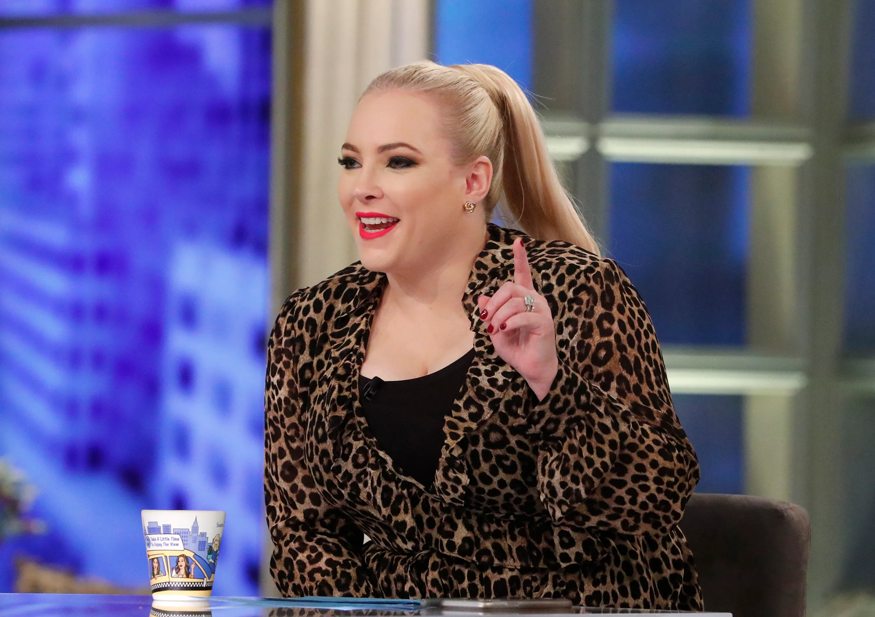 Meghan McCain talking on "The View" in a leopard print jacket.