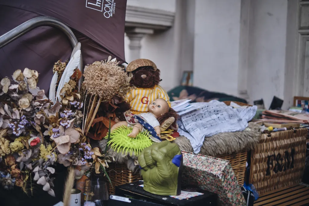 He peels into a plastic bottle at night to avoid leaving his tent and has decorated his porch with flowers, bicycles and teddy bears.