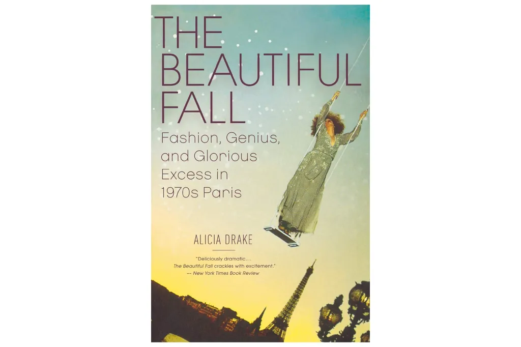 Book cover for "The Beautiful Fall: Fashion, Genius, and Glorious Excess in 1970s Paris" by Alicia Drake, featuring a woman on a swing above the Eiffel Tower.