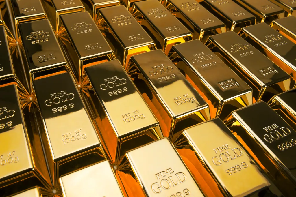Illustration of an array of fine gold bars, each labeled "FINE GOLD 999.9 NET WT 1000g."