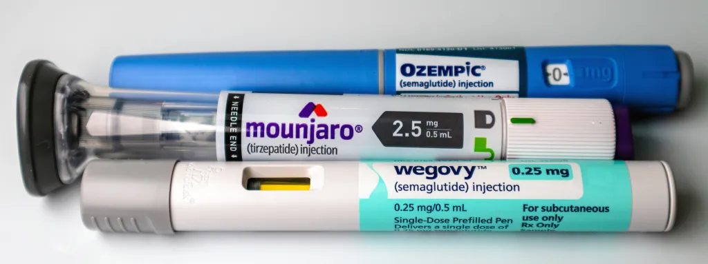 Ozempic, Mounjaro, and Wegovy injectable pens, used for diabetes and weight management, on a white background.