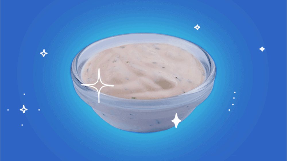 A color GIF showing a bowl of ranch dressing with sparkles flashing around it.