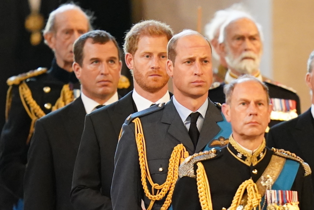 Peter Phillips, Prince Harry, Prince William, and Edward, Earl of Wessex follow the bearer party carrying Queen Elizabeth II's coffin into Westminster Hall.