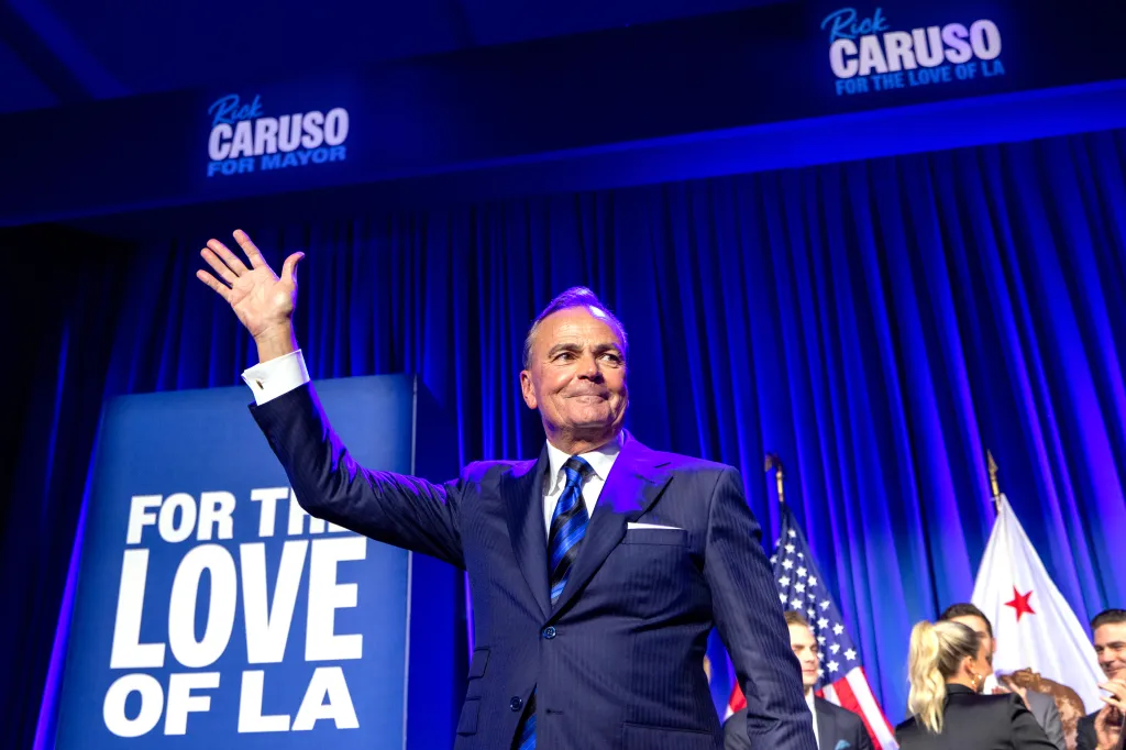 Rick Caruso, a Los Angeles mayoral candidate, waving to the audience at his election night party.