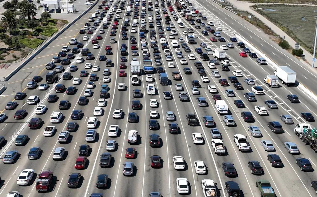 Aerial view of traffic on a multi-lane highway in Oakland, California, near the San Francisco-Oakland Bay Bridge.