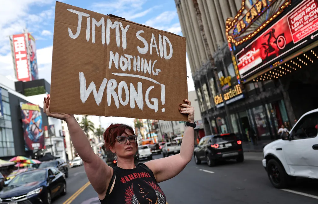 A demonstrator holding a sign that reads "JIMMY SAID NOTHING WRONG!" in protest of the suspension of "Jimmy Kimmel Live!"