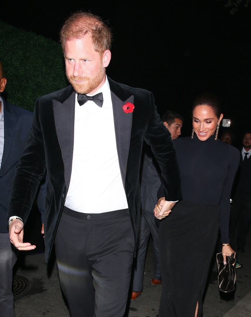 Prince Harry and Meghan Markle holding hands while attending an event.