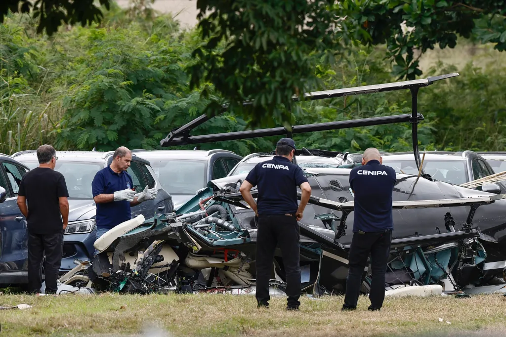 CENIPA technicians inspect the wreckage of a helicopter following a mid-air collision in Rio de Janeiro, Brazil.