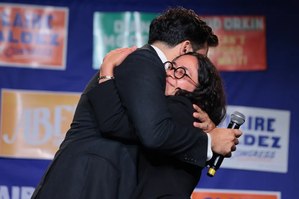 NYC Congressional candidate Claire Valdez hugging NYC Mayor Zohran Mamdani at a primary-night watch party.