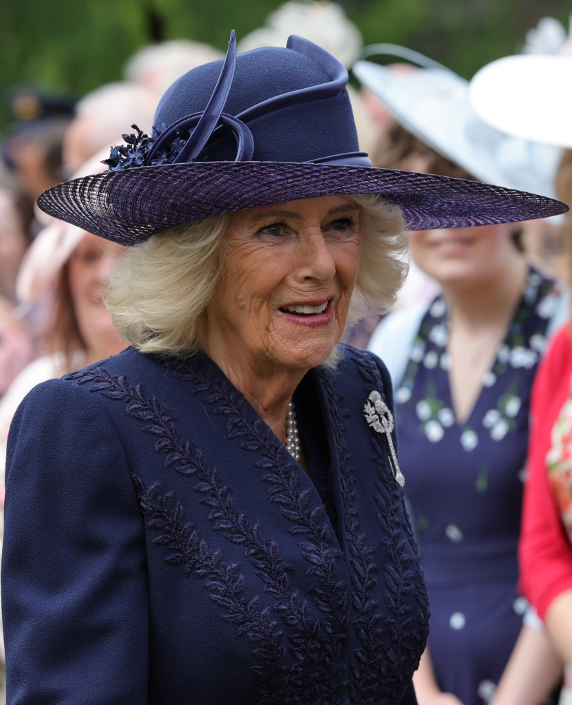 Queen Camilla speaking to guests during a Garden Party.