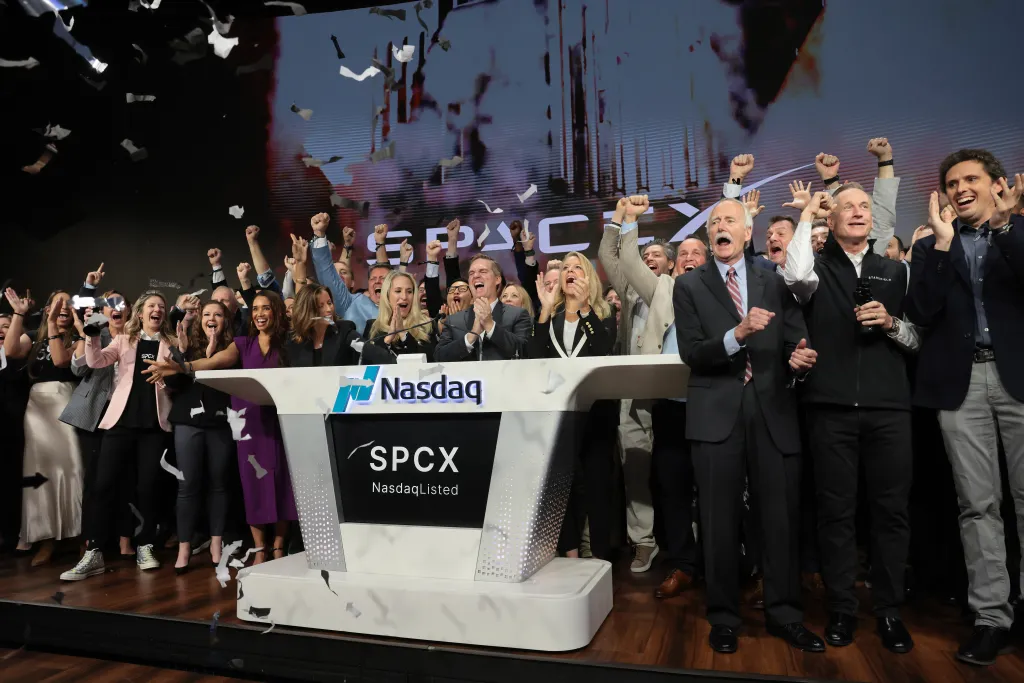 SpaceX leadership celebrate at Nasdaq Marketsite as the company's IPO launches.