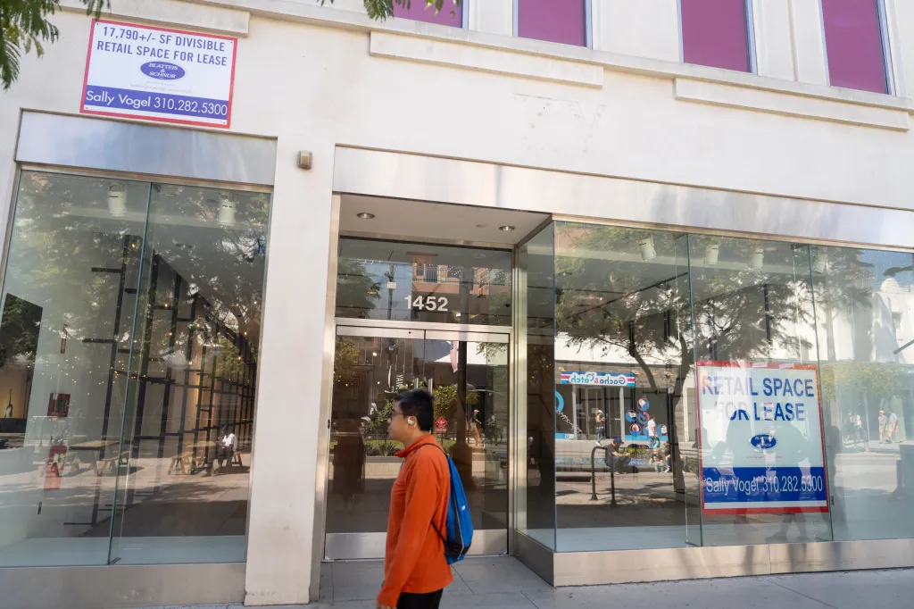 Street-level view of a commercial building in Santa Monica with multiple "Retail Space For Lease" signs visible in the windows and on the exterior.