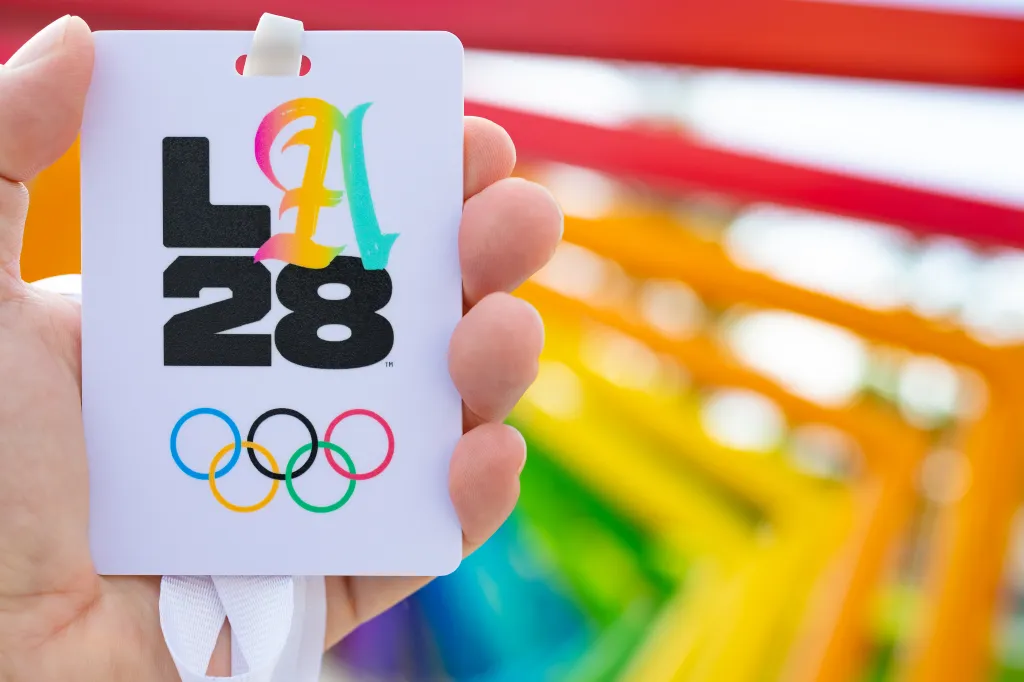 Hand holding a 2028 Los Angeles Olympic work card.