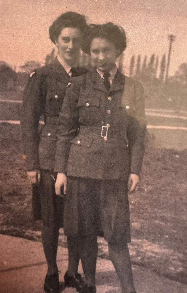 Margaret Ham, when she was younger, in uniform with another woman.