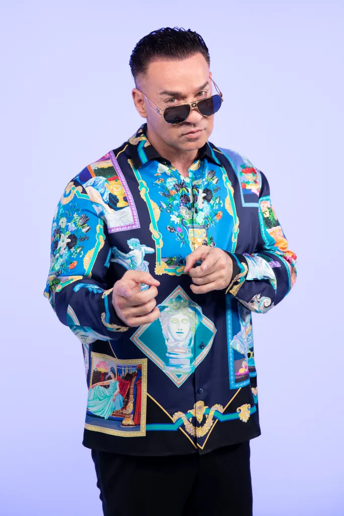 Mike Sorrentino, aka "The Situation," posing in a colorful patterned shirt and sunglasses.