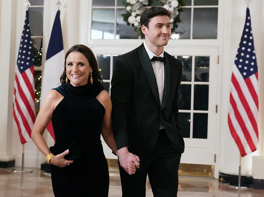 Actress Julia Louis-Dreyfus and her son Charlie Hall arriving at the White House for a state dinner.