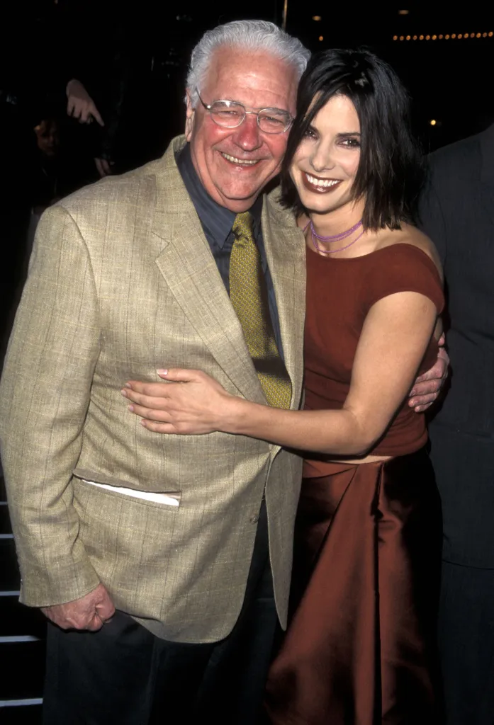 Sandra Bullock and her father John Bullock pose smiling at the "Forces of Nature" Westwood Premiere.