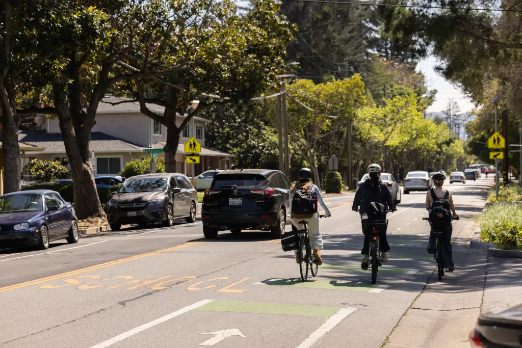 Bicyclists and vehicular traffic share Oak Grove Avenue in Atherton, California.