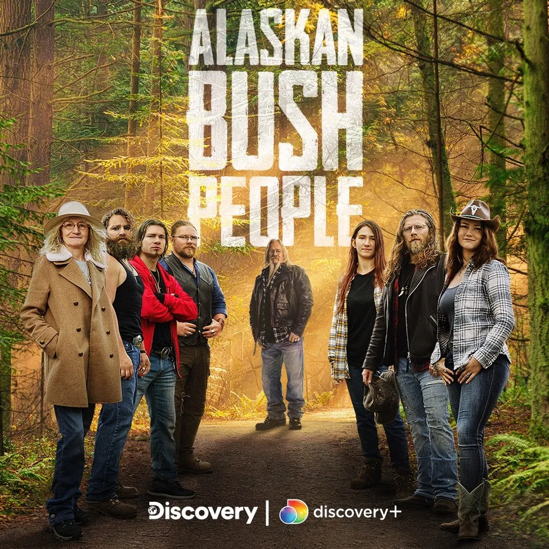 Promotional poster for the show "Alaskan Bush People" featuring eight cast members standing on a forest path.