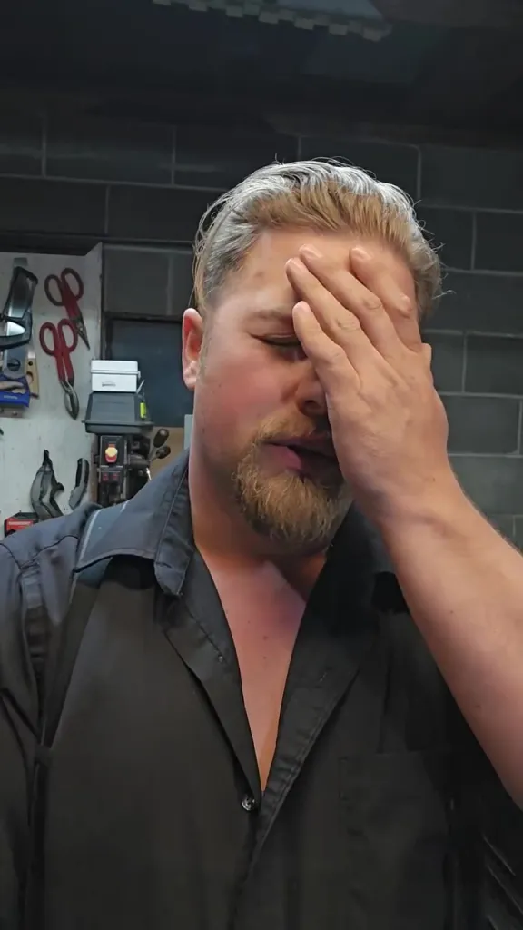 Noah Brown, an "Alaskan Bush People" star, with his hand covering his face.