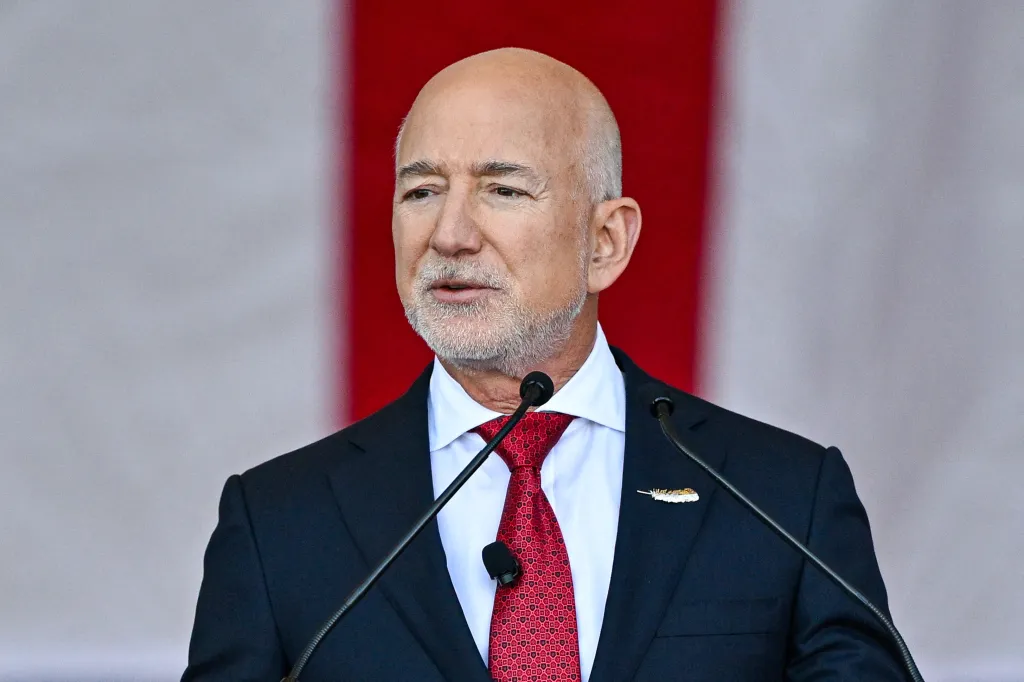 Blue Origin CEO Jeff Bezos speaking at a podium.
