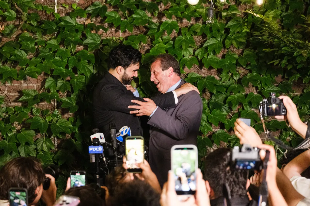 Brad Lander and Zohran Mamdani embracing at Lander's victory party.