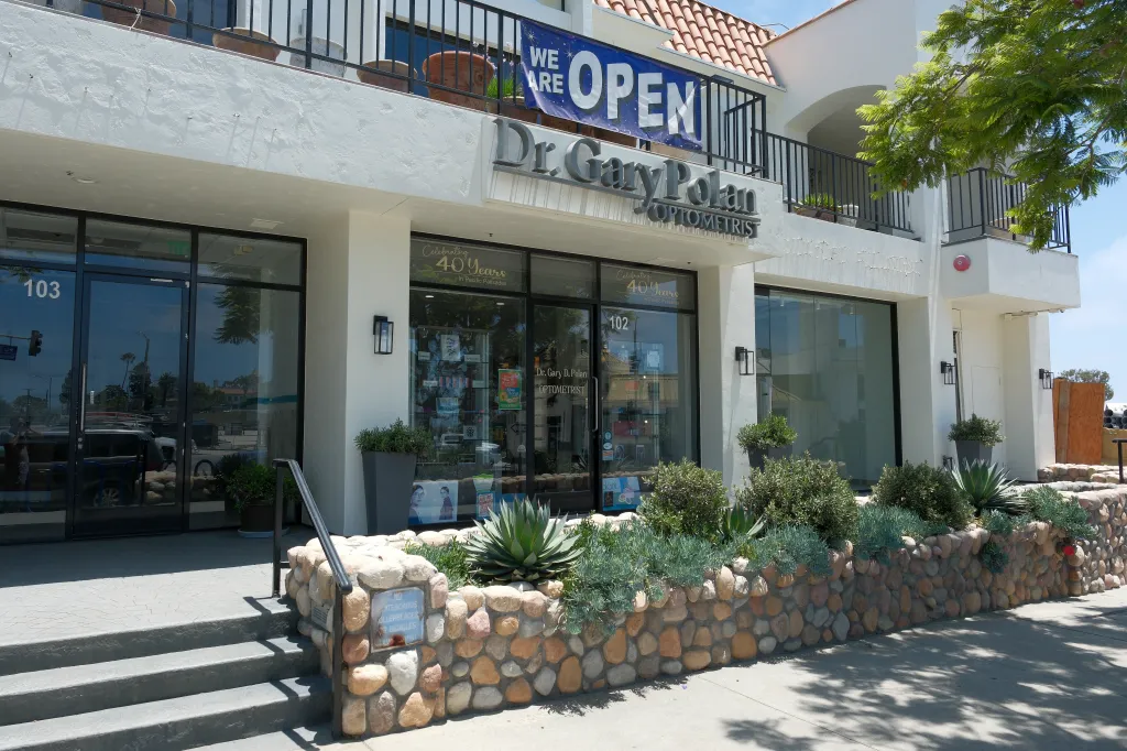 Dr. Gary Polan Optometrist office building with an "Open" banner in Pacific Palisades.