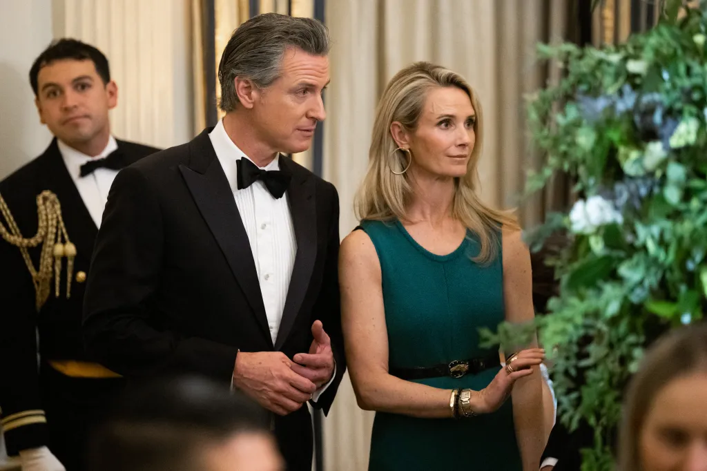 California Governor Gavin Newsom and his wife, Jennifer Siebel Newsom, attending a black-tie dinner.