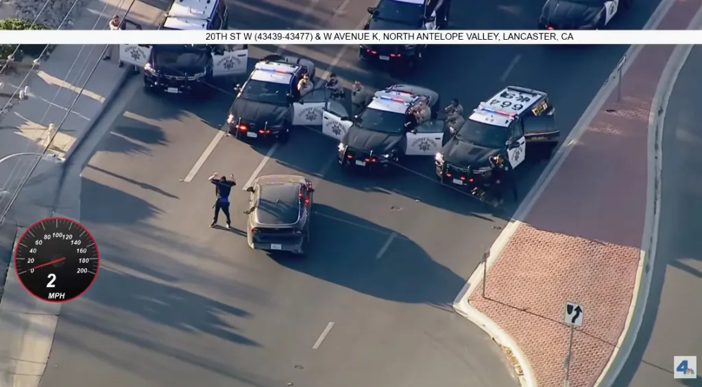 Aerial view of California Highway Patrol officers surrounding a vehicle on 20th St W and W Avenue K in North Antelope Valley, Lancaster, CA.