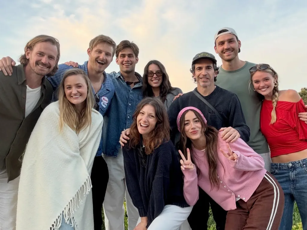 A group of ten people, including Charlie Hall, smiling and posing for a photo outdoors.