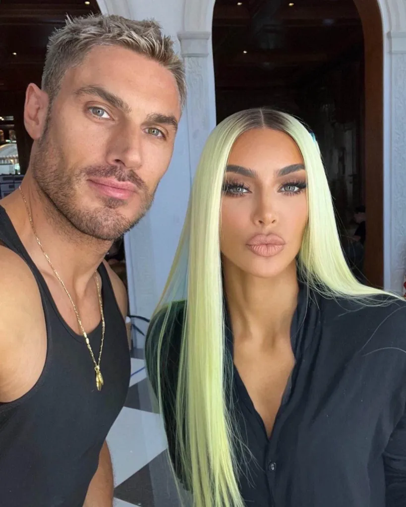 Chris Appleton and Kim Kardashian posing for a photo.