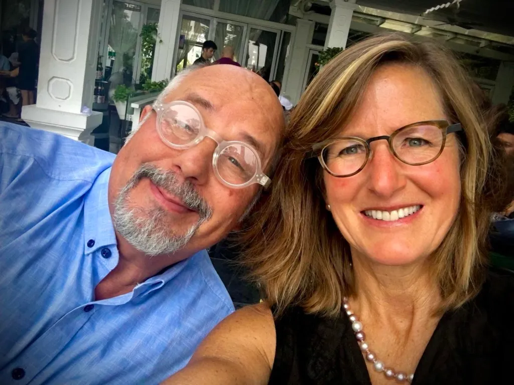 Christine Begin Nickell with a man in glasses.