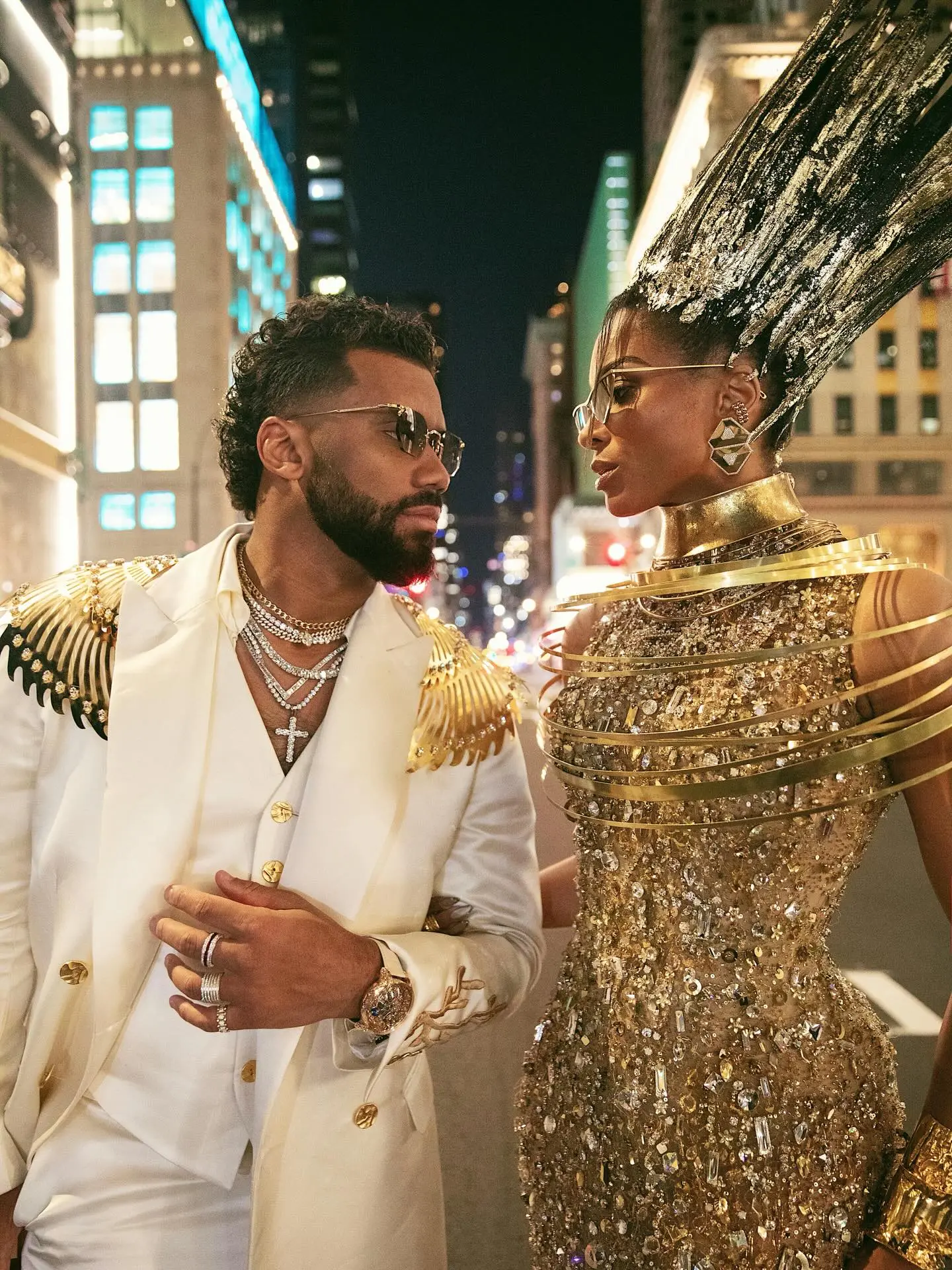 Ciara and Russell Wilson in elaborate gold and jeweled outfits.