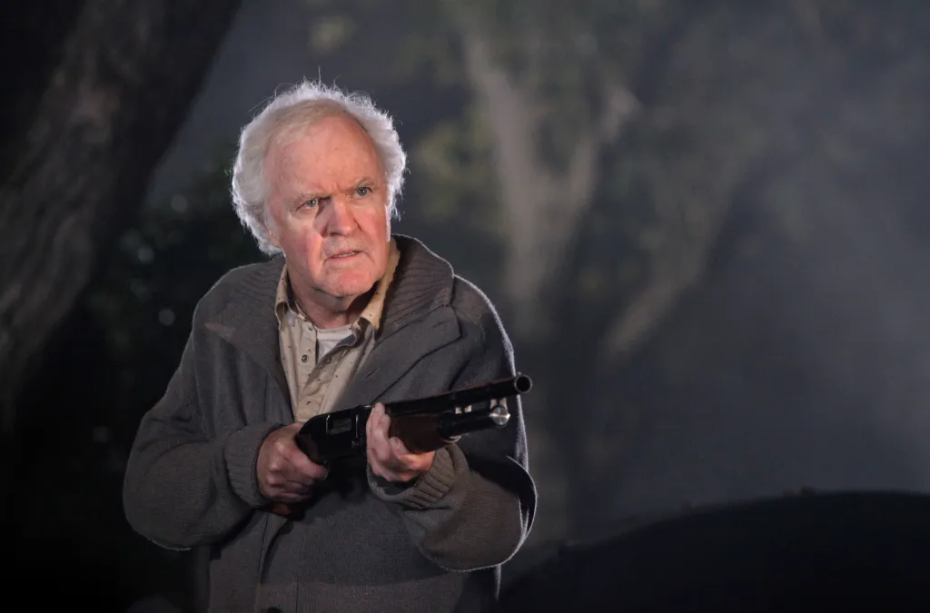 James Handy holding a shotgun on "Castle."