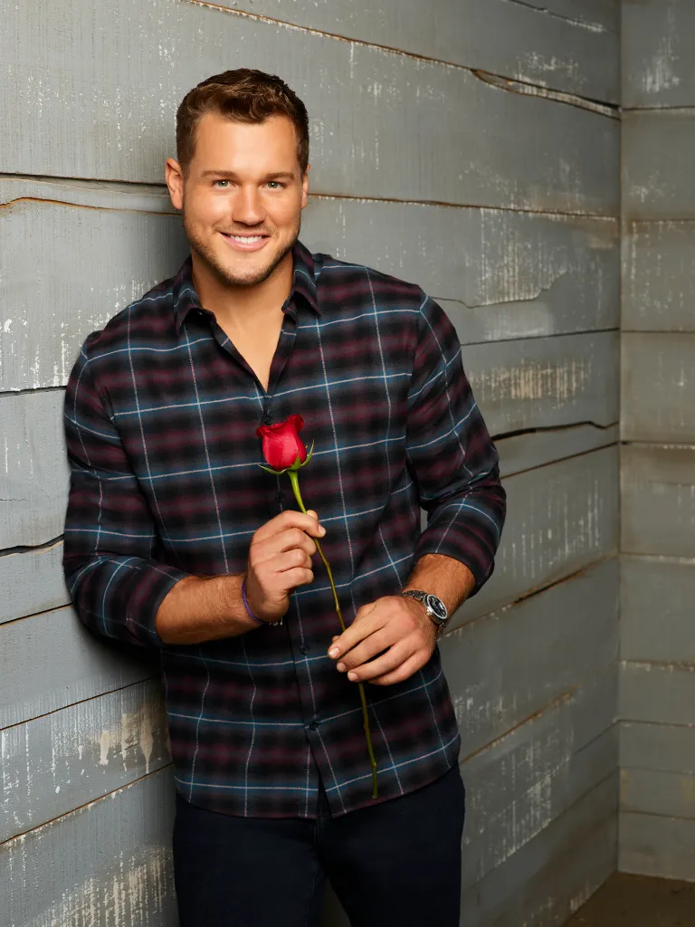 Colton Underwood, from The Bachelor Season 23, holds a single red rose.