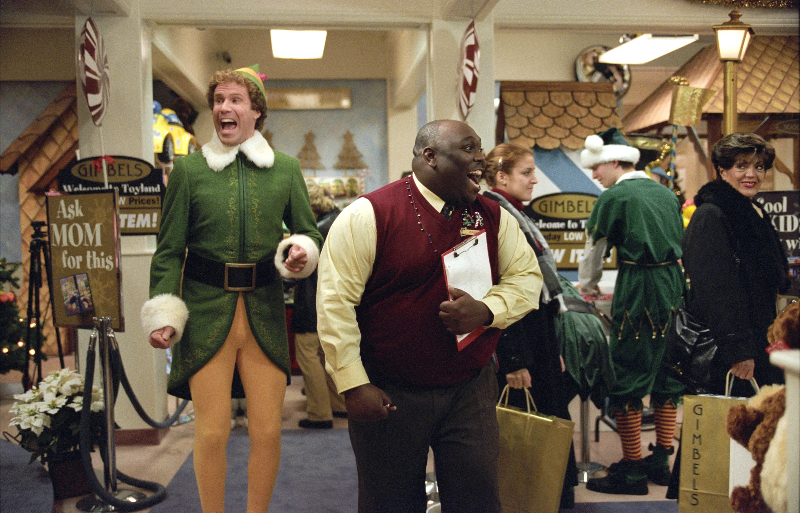 Will Ferrell as Buddy the Elf and Faizon Love as a Gimbels manager, both open-mouthed, in the 2003 film "Elf."