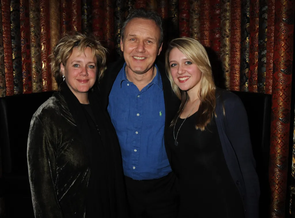 Sarah Fisher, Anthony Head, and Emily Head smiling at an afterparty.