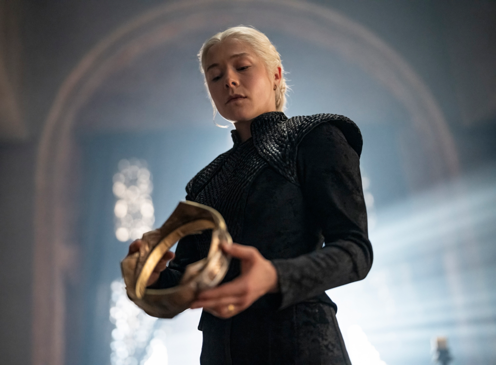 Emma D'Arcy as Rhaenyra Targaryen holding a crown in 