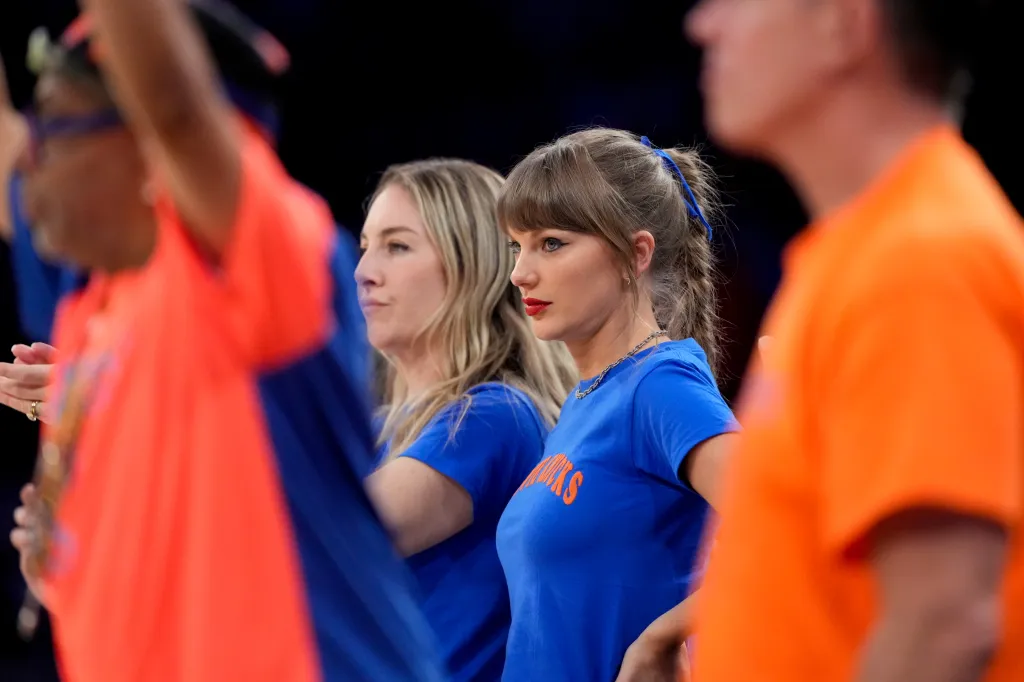 Taylor Swift and Este Haim watching Game 4 of the NBA Finals.