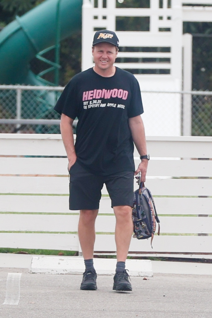 Spencer Pratt wearing a black T-shirt and a "Pratt" baseball cap.