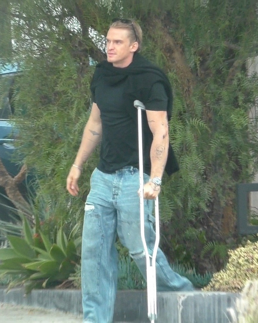 Cody Simpson walks with a crutch after a meeting in Hollywood.