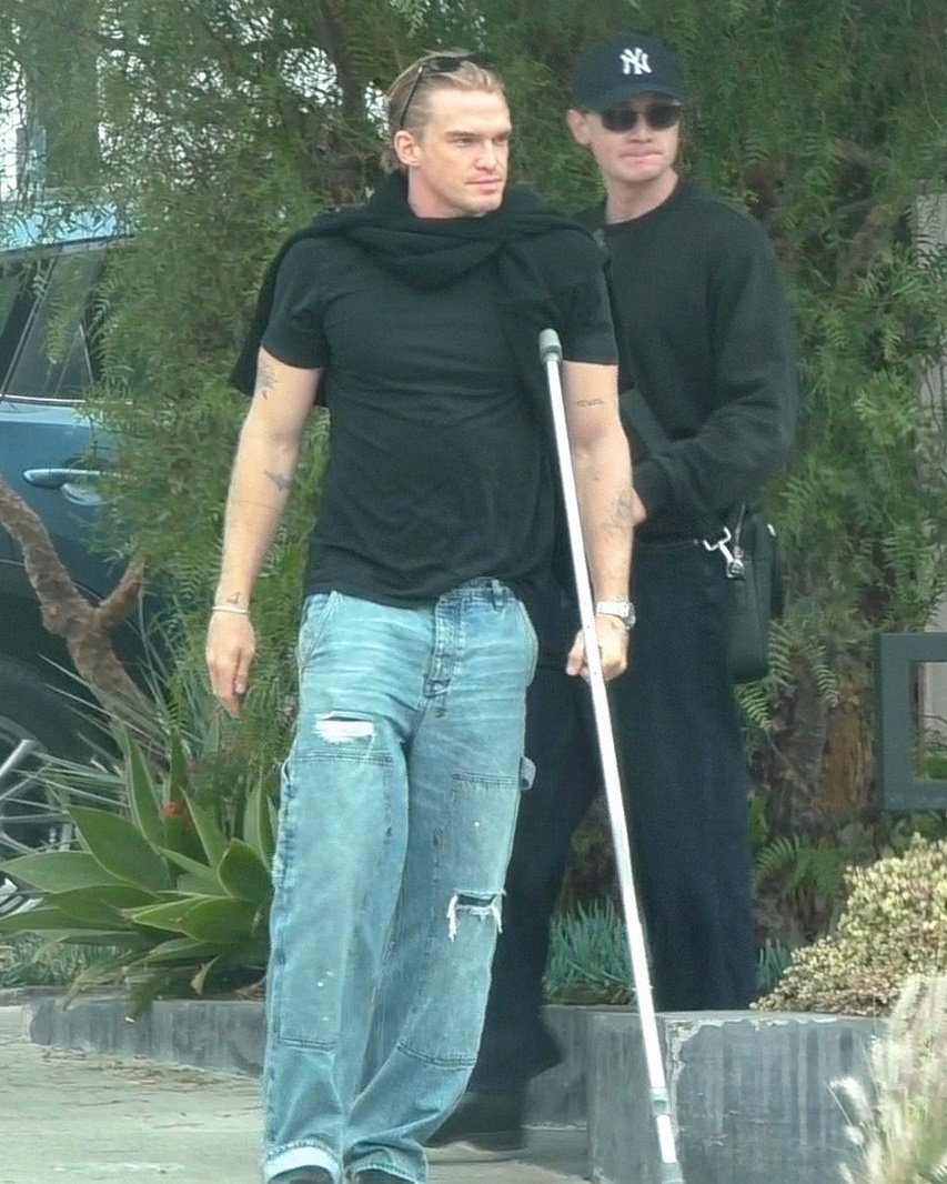 Cody Simpson walking with a crutch after a meeting in Hollywood.