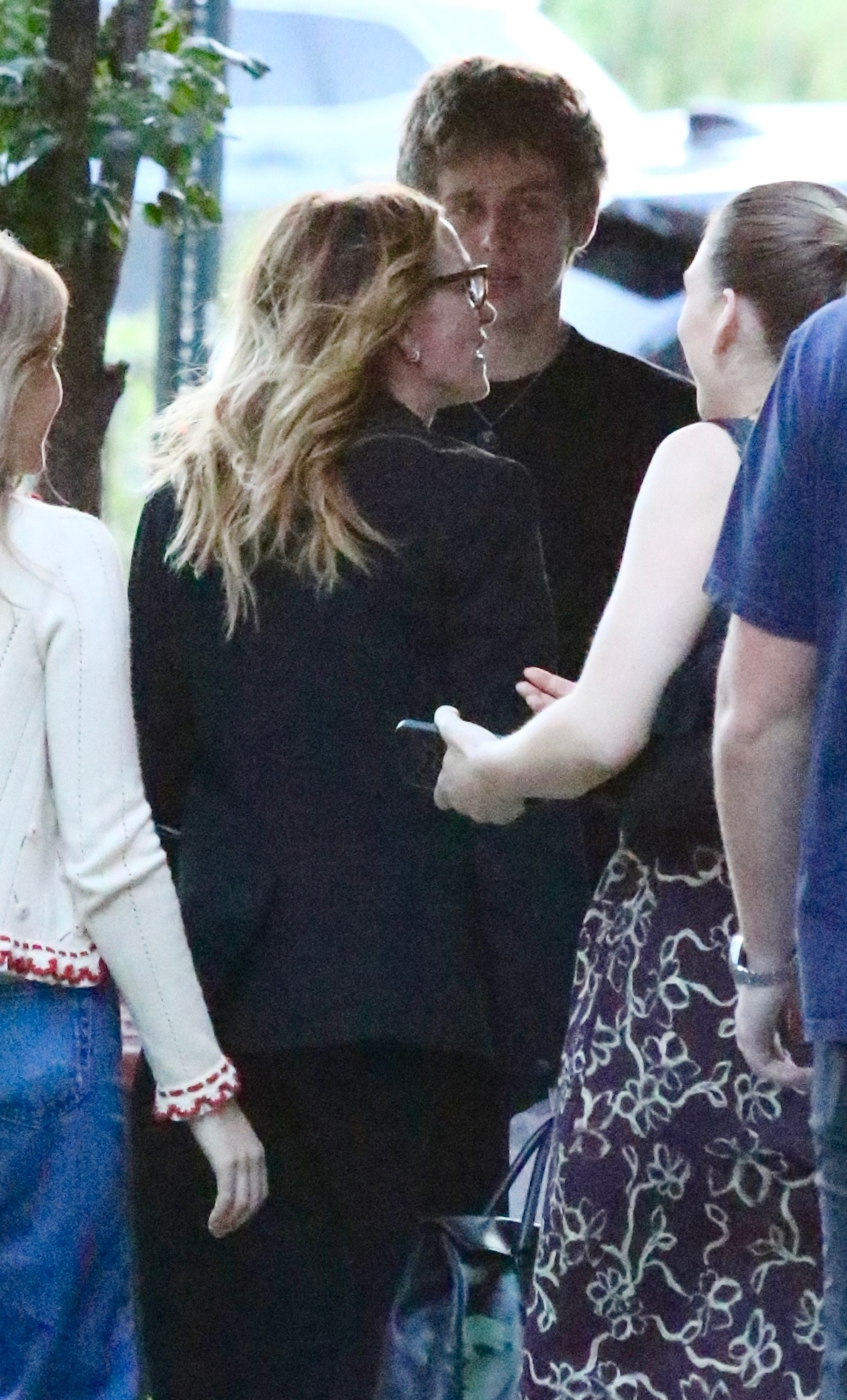 Julia Roberts in a black outfit, smiling with her son Henry and daughter Hazel.