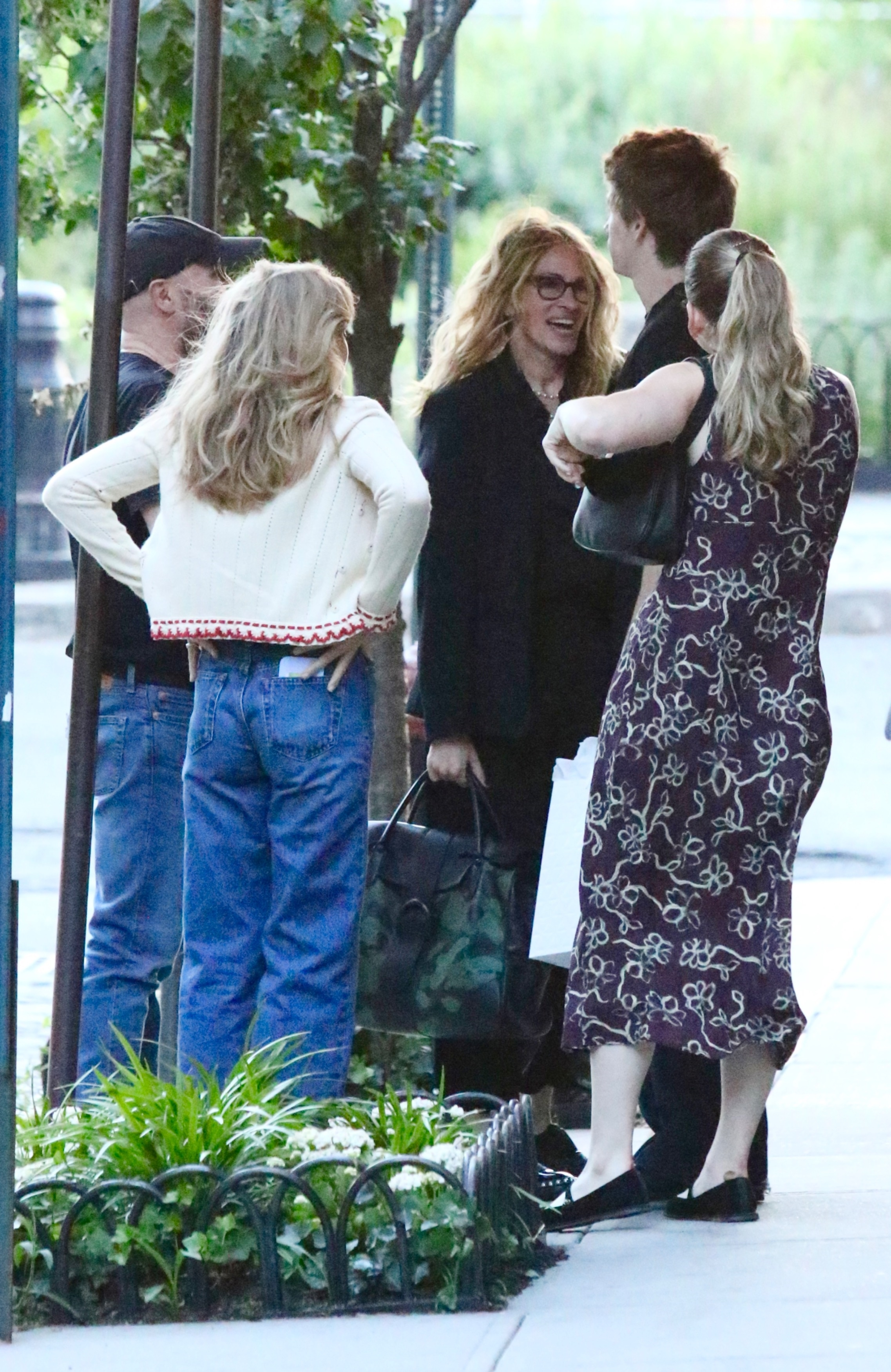 Julia Roberts smiling and chatting with her son Henry and daughter Hazel outside the Jane Hotel.