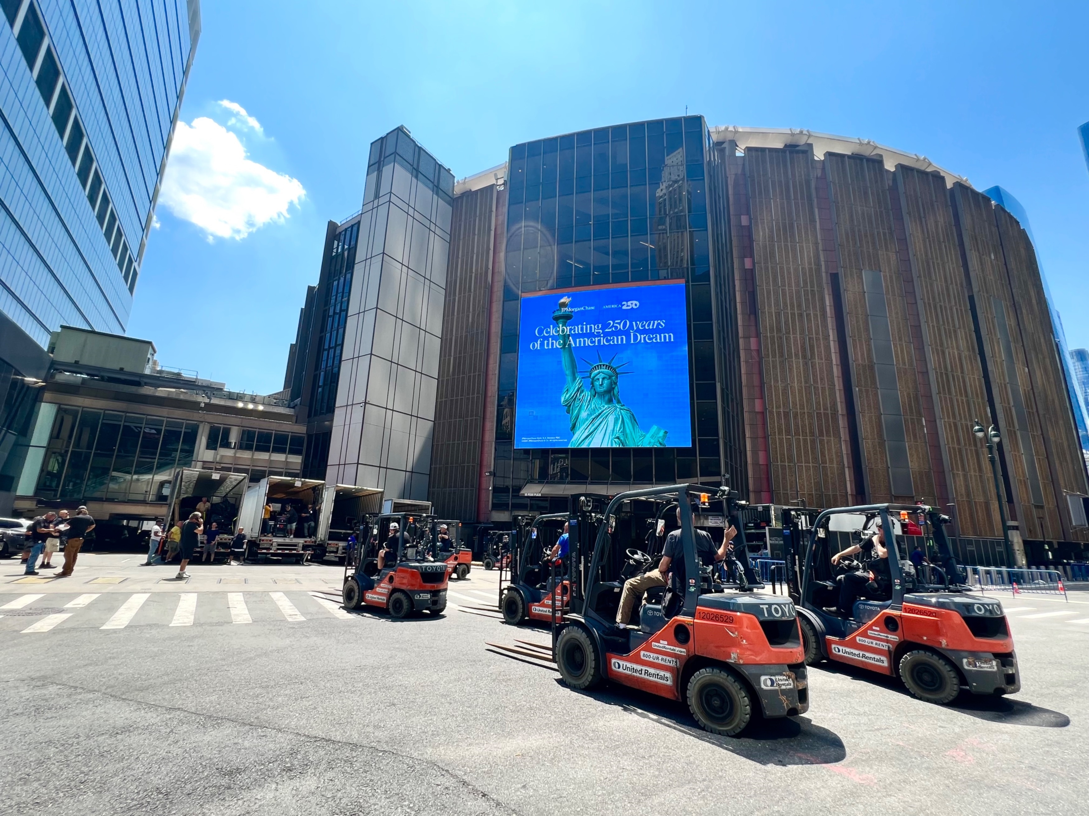 Forklifts are outside Madison Square Garden where equipment is being delivered for an event.